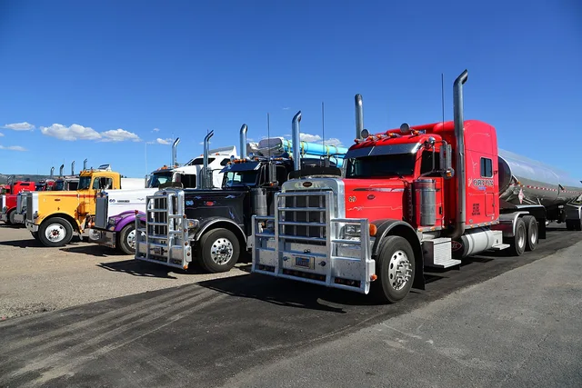 truck, semi-trailer, usa, nature, towing vehicle, red, yellow, violet, summer, sunny, traffic, carriage of goods, tank truck, transport, parking spot. Towtruck guide: Colorado pass vs. Front Range city work
