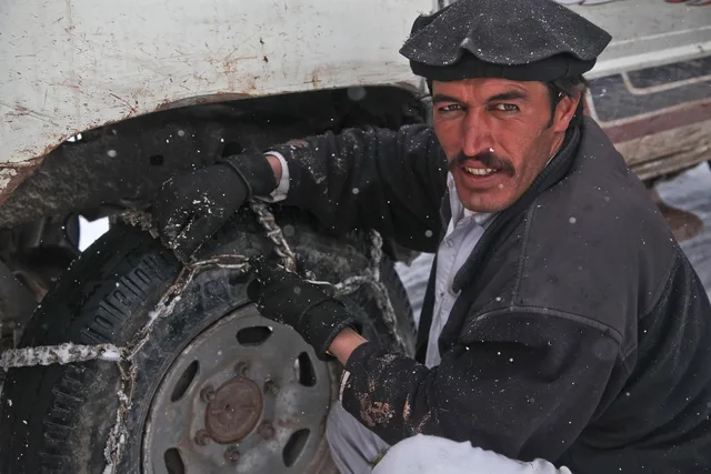 soldier, skid chain, nature, chain, uniform, army, patrol, afghanistan, military vehicle, military, vehicle, truck, snow, war, gray truck, gray army, gray war. A guide to Midwest winter towing equipment and safety