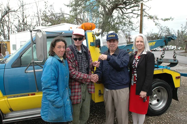 Pass Christian, Miss., January 17, 2006 -- Wrecker driver Johnny Hogan and his daughter Fay (left) accept the keys to a used wrecker donated by the California Tow Truck Driver's Association from FEMA Federal Coordinating Officer Jesse Munoz and Volunteer Agency Liaison Sue Ann London (right). Mr. Ho. How a towing company tracks cash flow week to week for first-year owners