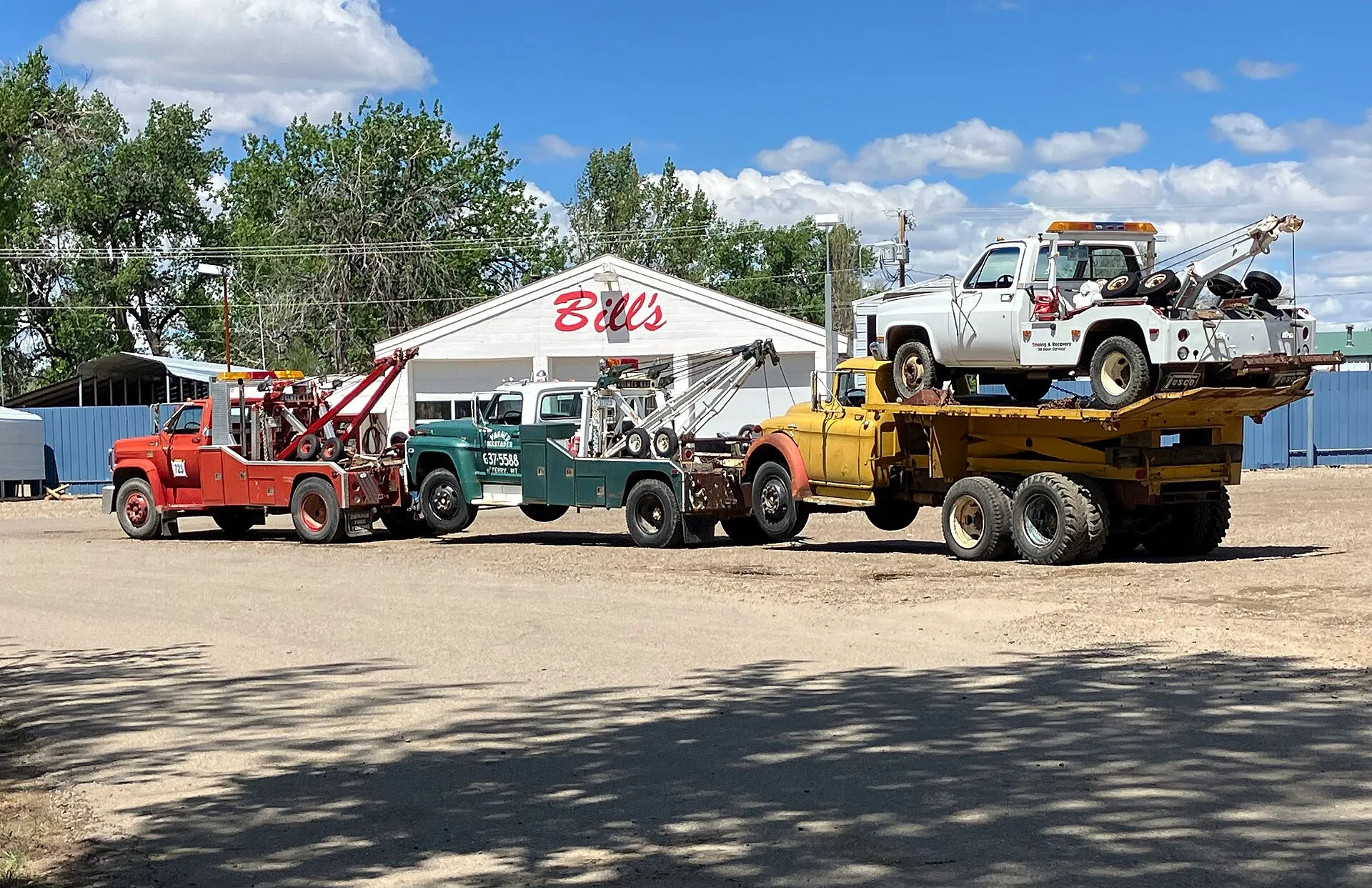 Tow truck towing a tow truck towing a tow truck hauling a tow truck. A working business plan for a towing company
